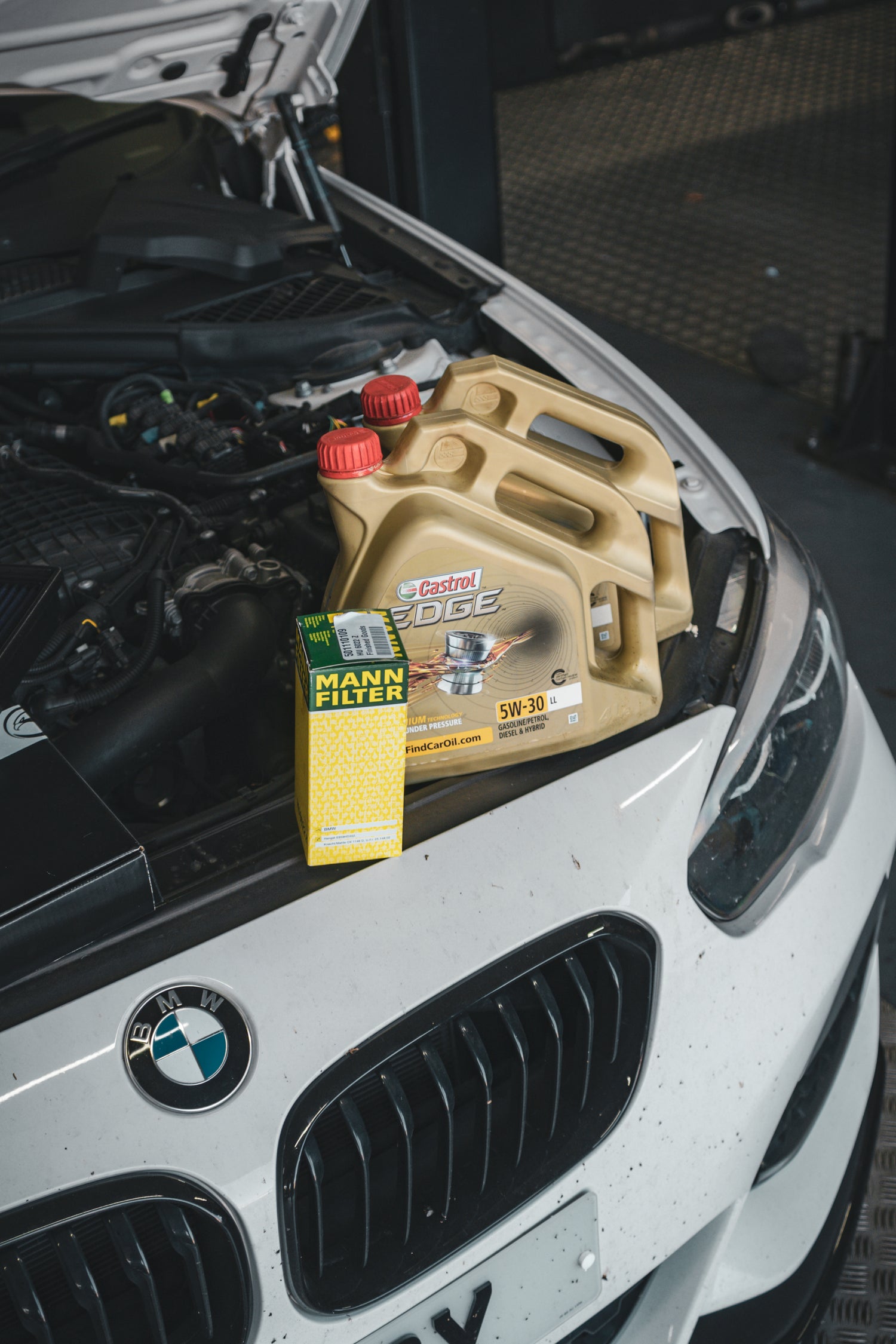 Pouring new automotive engine oil into an engine