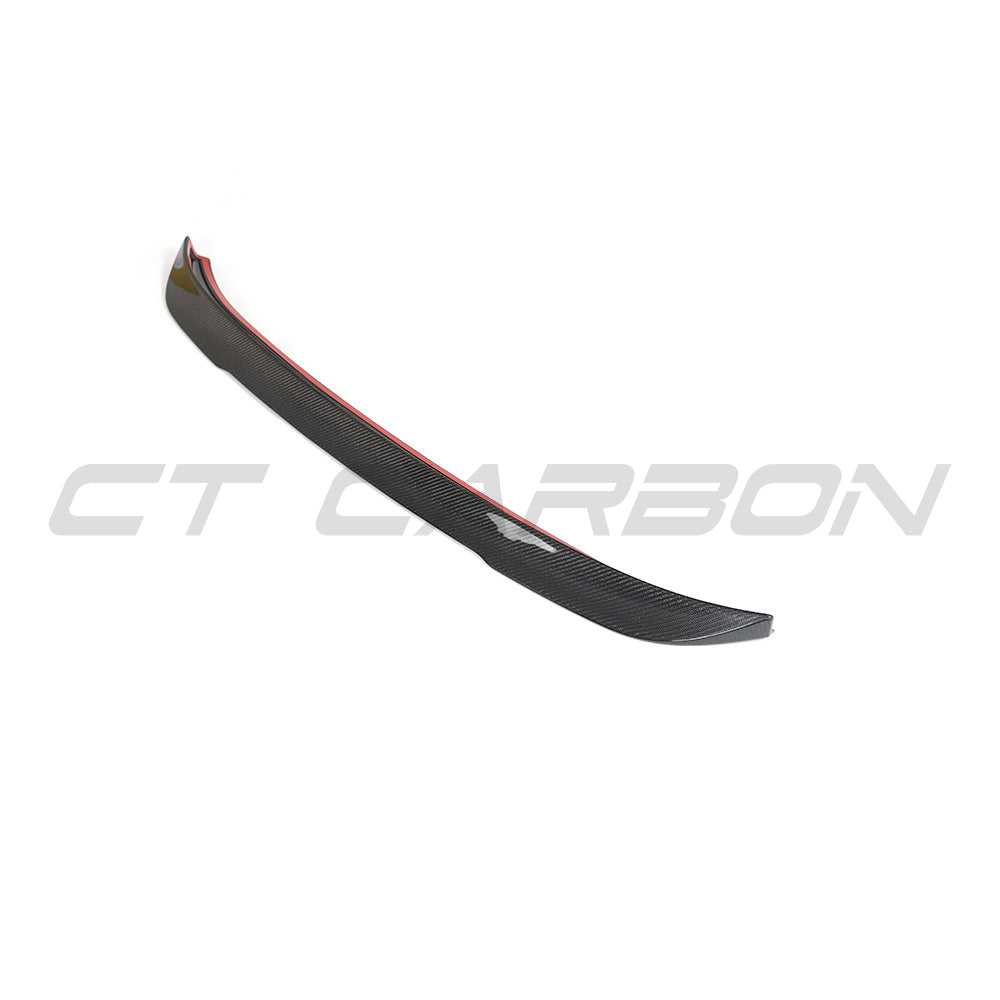 BMW G02 X4 and F98 X4M carbon fibre spoiler by CT Carbon, showing the sleek aerodynamic design on the vehicle's rear.