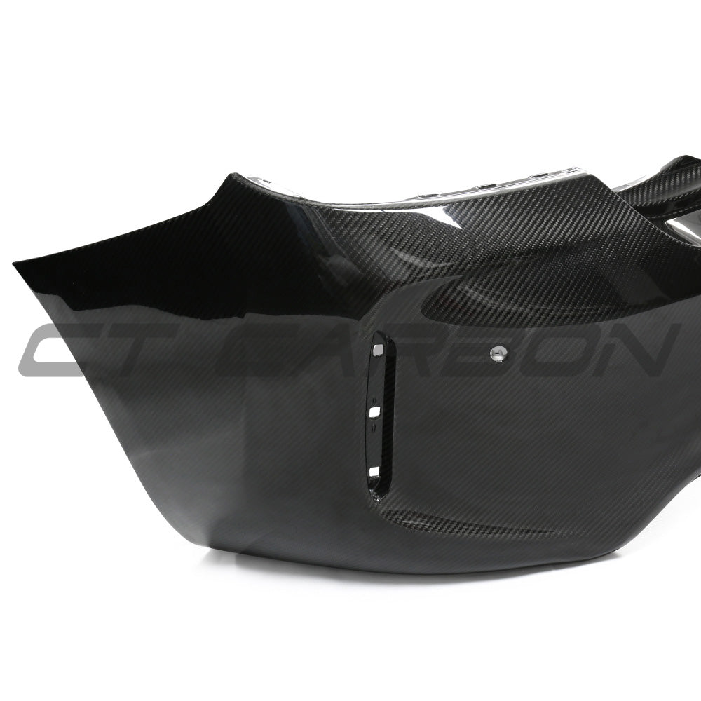 BMW F87 M2 Carbon Pre-Preg Fibre Rear Bumper by CT Carbon, showcasing the sleek, lightweight automotive bumper design.