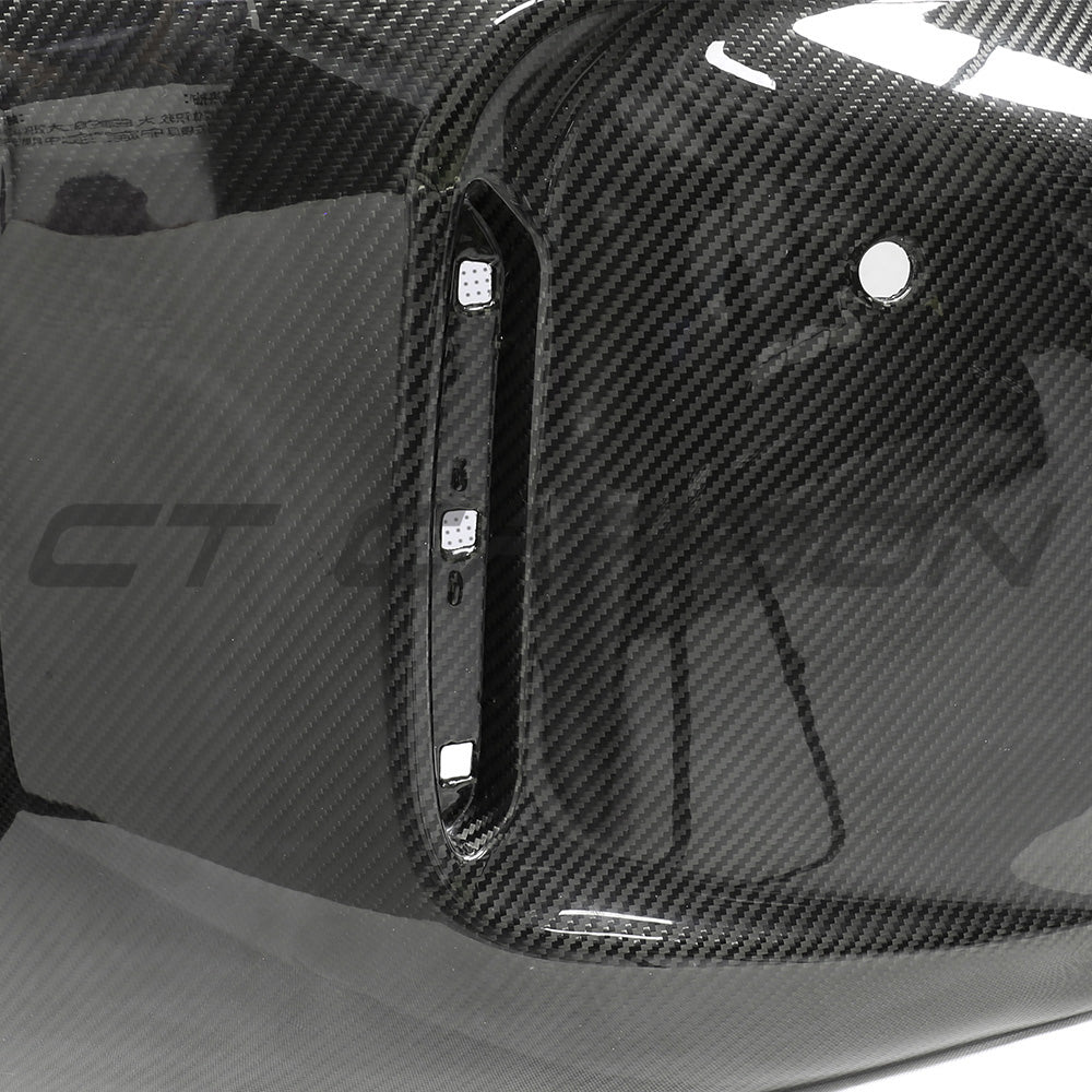 BMW F87 M2 carbon pre-preg fibre rear bumper by CT Carbon, showcasing the lightweight, aerodynamic design and high-quality finish.