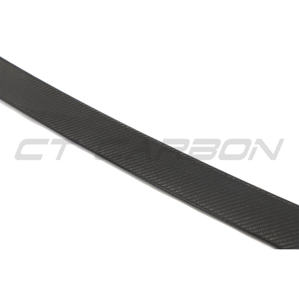 BMW G02 X4 and F98 X4M carbon fibre spoiler by CT Carbon, showcasing the sleek, aerodynamic design on the car.
