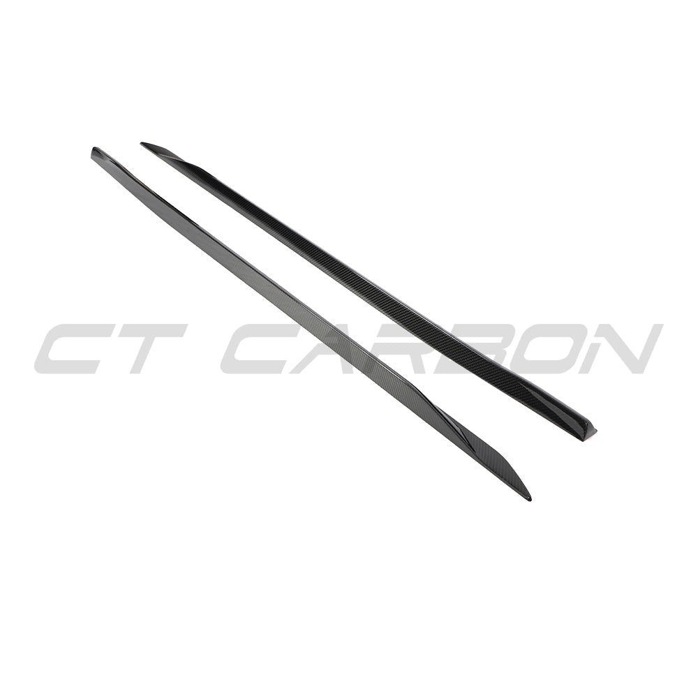 BMW 5 Series G60/G61 2024+ CT Carbon carbon fibre side skirts installed on the vehicle's sides, enhancing sporty appearance.