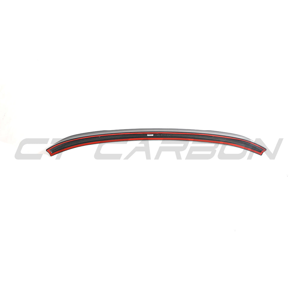 BMW G02 X4 and F98 X4M carbon fibre spoiler by CT Carbon, shown installed on the vehicle's rear for aerodynamic enhancement.