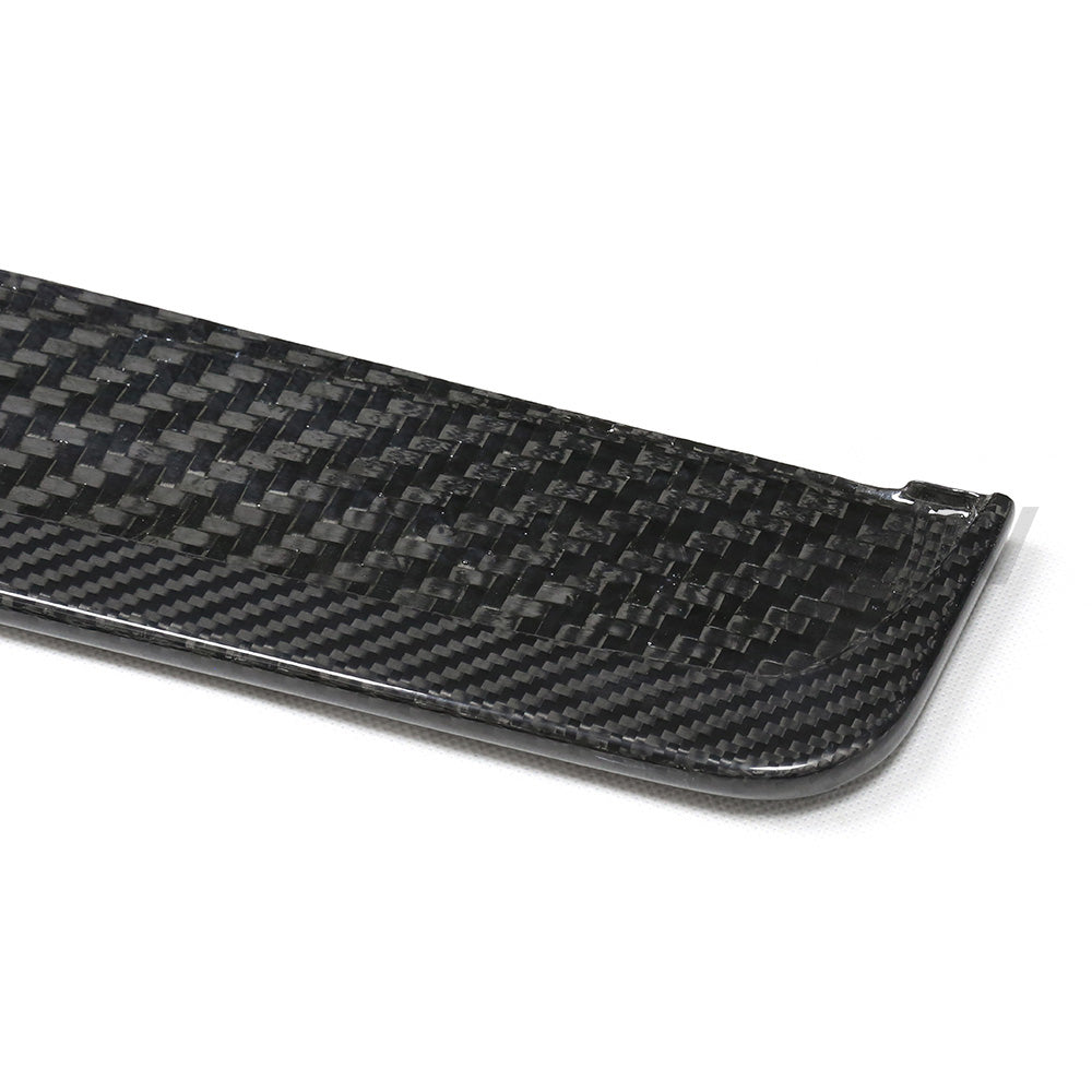BMW G87 M2 carbon fibre side skirts by CT Carbon, sleek and aerodynamic, shown installed on the car's sides.