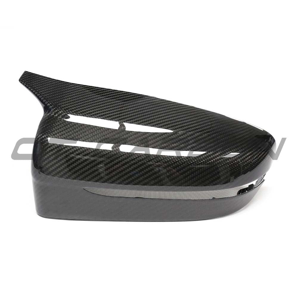 BMW G42 2 Series 2022+ RHD dry carbon mirror cover replacements by CT Carbon, showcasing sleek, textured mirror housing detail.