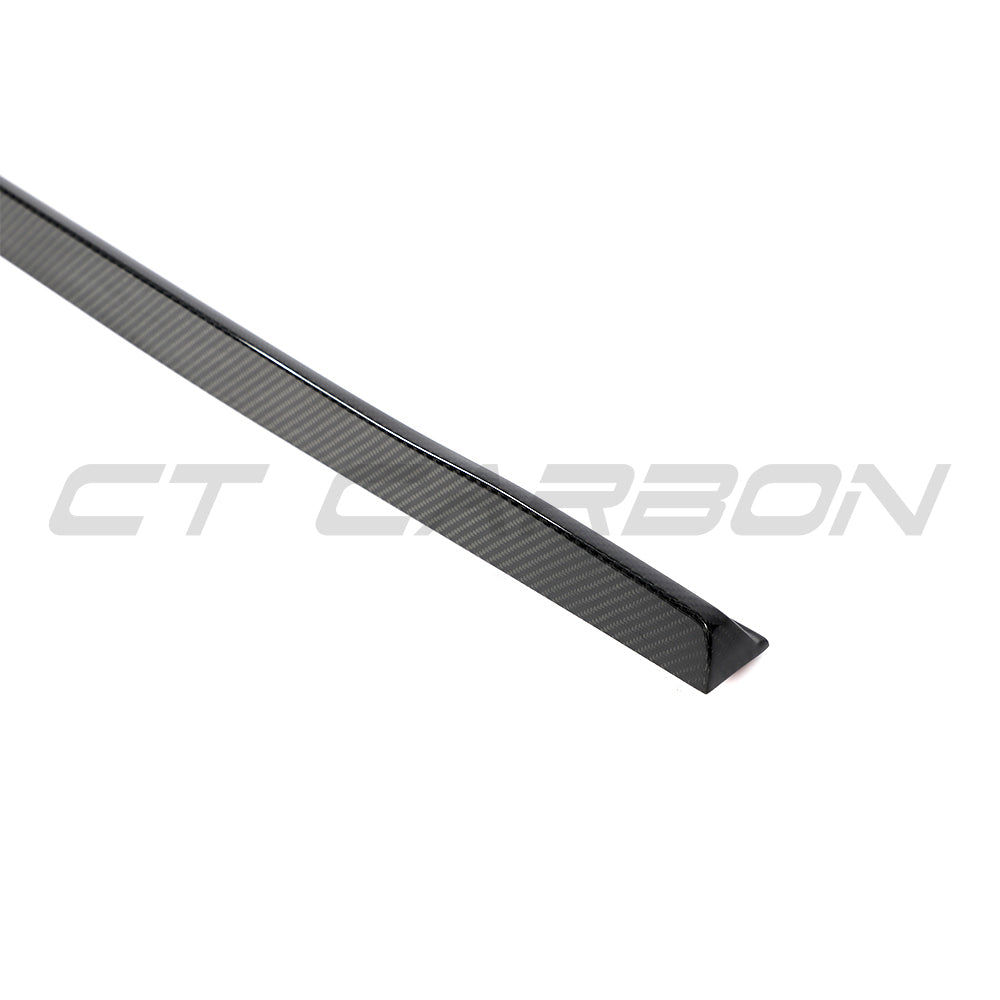 BMW 5 Series G60/G61 2024+ CT Carbon carbon fiber side skirts mounted on the vehicle's side for a sporty look.
