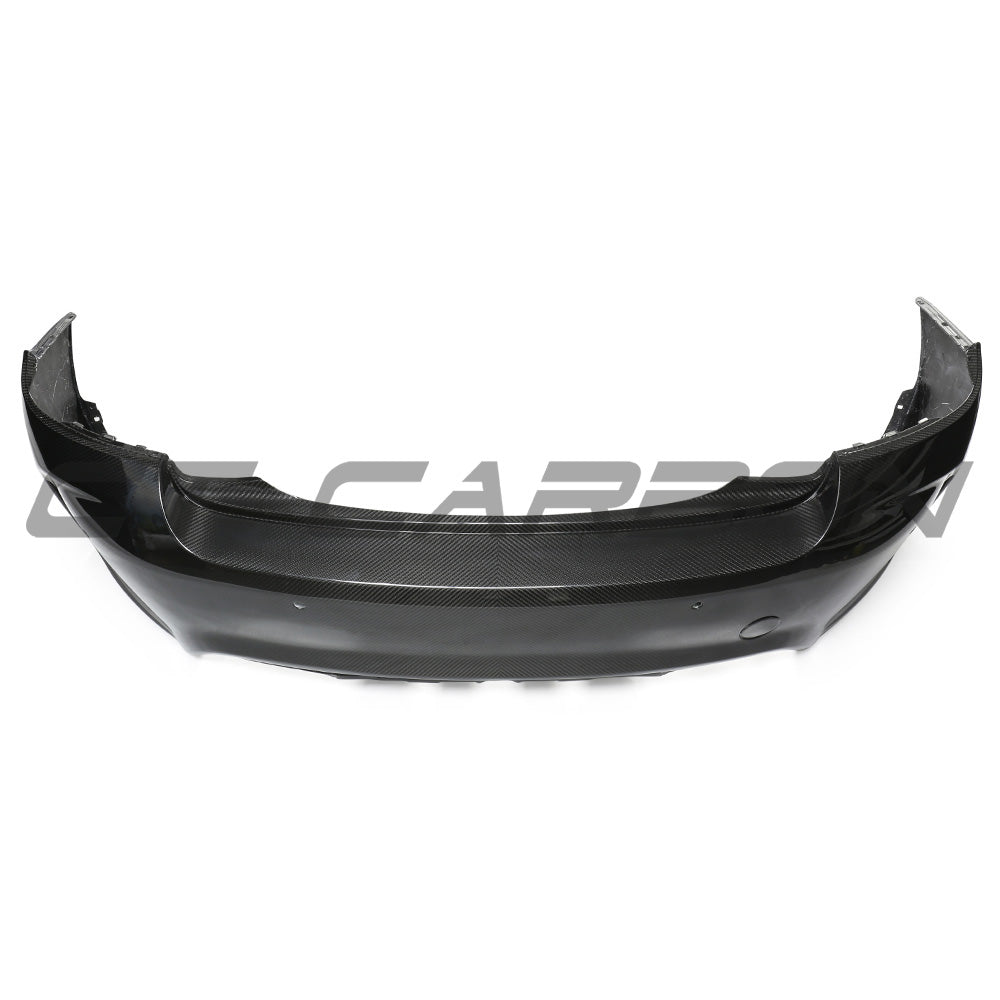 BMW F87 M2 Carbon Pre-Preg Fibre Rear Bumper by CT Carbon, showing sleek black lightweight automotive bumper with carbon fiber finish.
