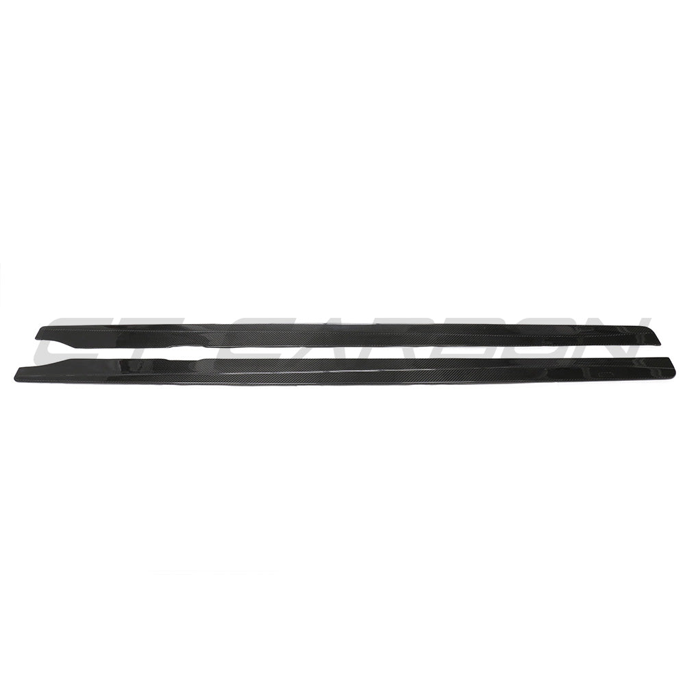 BMW G87 M2 carbon fibre side skirts by CT Carbon, showcasing sleek, aerodynamic design and textured carbon fiber finish.