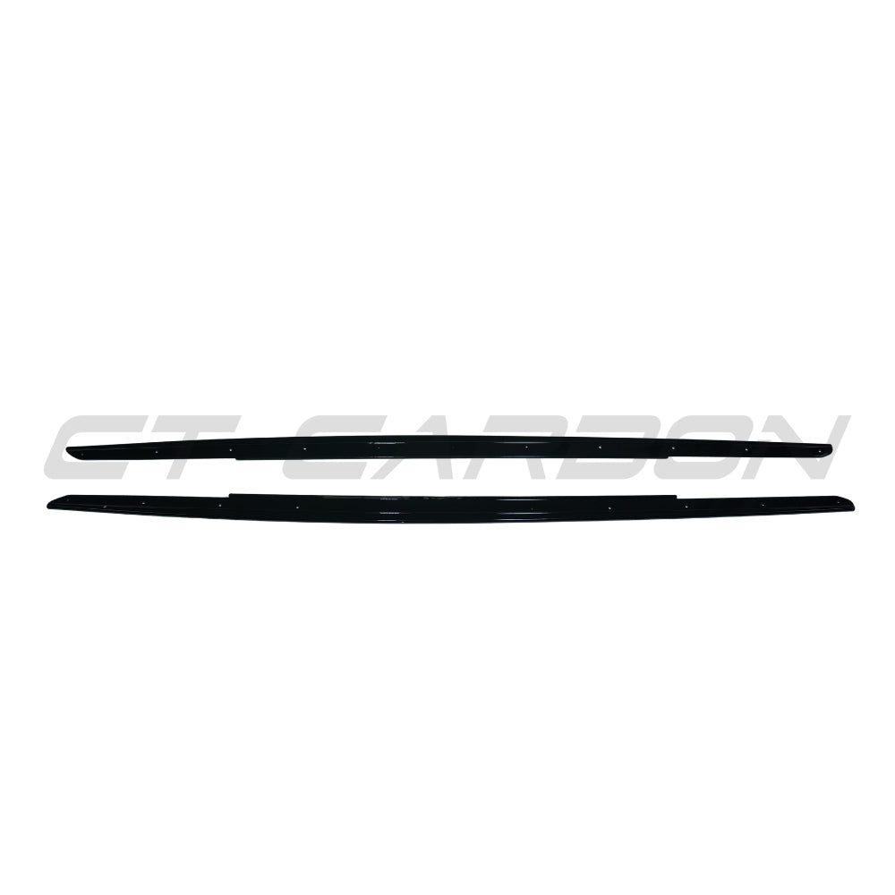 Gloss black side skirts for BMW 5 Series F10/F11 2011-2017 by CT Carbon, showing sleek aerodynamic design on the vehicle side.