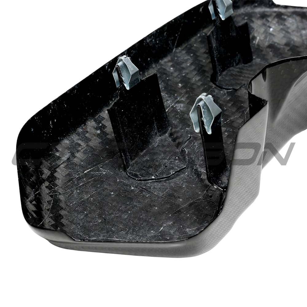 BMW F10 M5 2011-2016 carbon fibre battery cover by CT Carbon, showcasing the sleek, textured carbon fibre accessory.