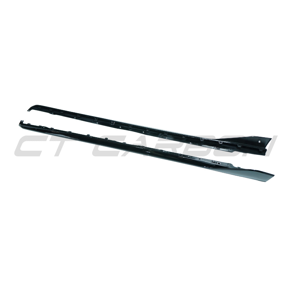 BMW F40 1 Series 2019-2024 CT Carbon gloss black side skirts installed on the vehicle, showcasing sleek aerodynamic design.
