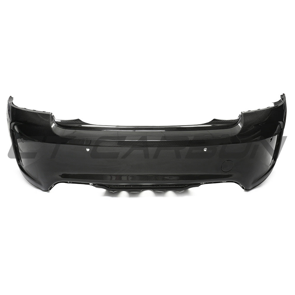 BMW F87 M2 Carbon pre-preg fibre rear bumper by CT Carbon, showing the sleek, lightweight design with carbon fibre finish.