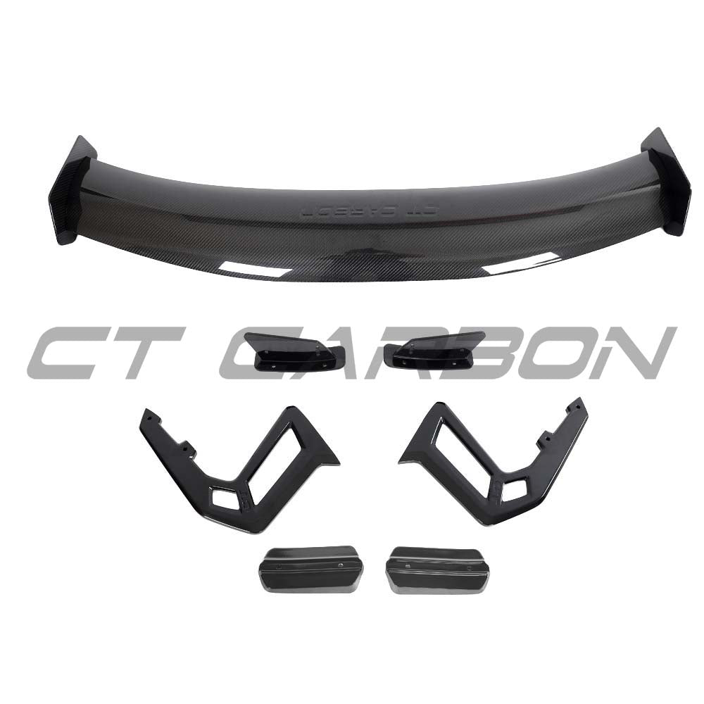 CT Carbon Lotus Emira full carbon fibre kit V2, showing lightweight, glossy carbon fibre panels and aerodynamic design details.