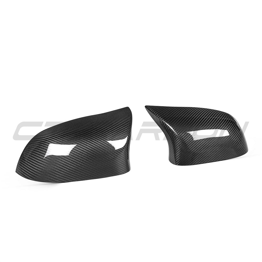 BMW X5/X6 F15/16 carbon fibre side mirrors by CT Carbon, showing sleek, lightweight mirror housings with reflective surfaces.