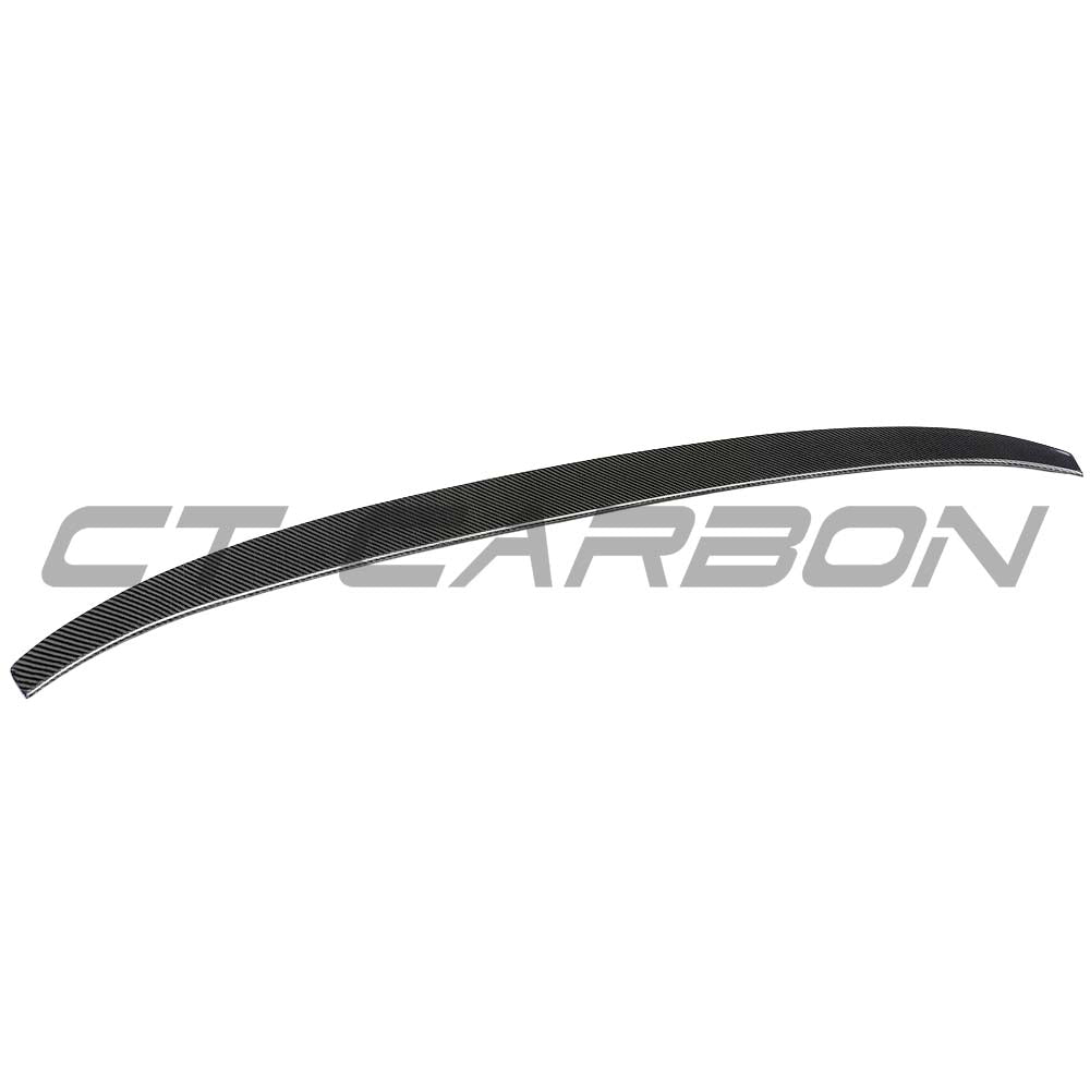 BMW F98 X4M CT Carbon V3 carbon fibre spoiler mounted on the rear of the vehicle, showcasing its sleek aerodynamic design.
