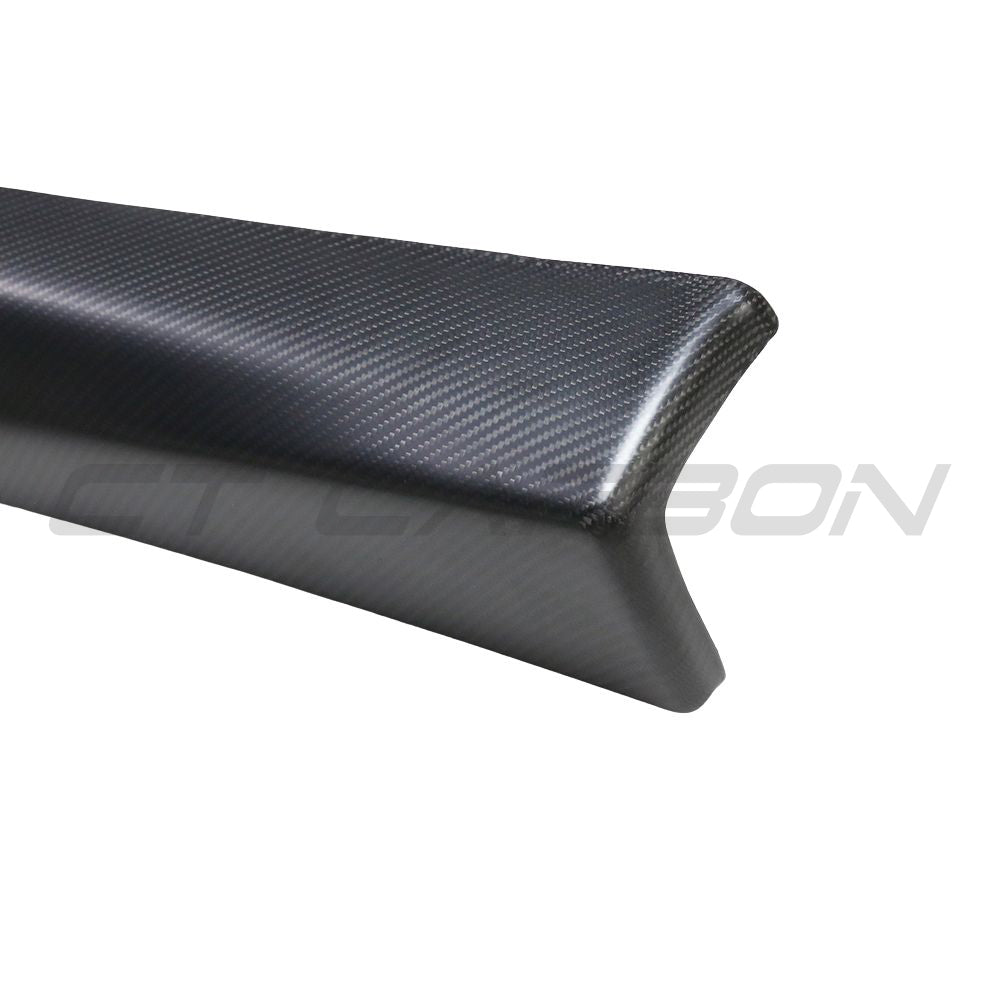 Tesla Model 3 2017-2023 carbon fiber interior door panel trim accessory by CT Carbon, showing sleek black carbon fiber surface.