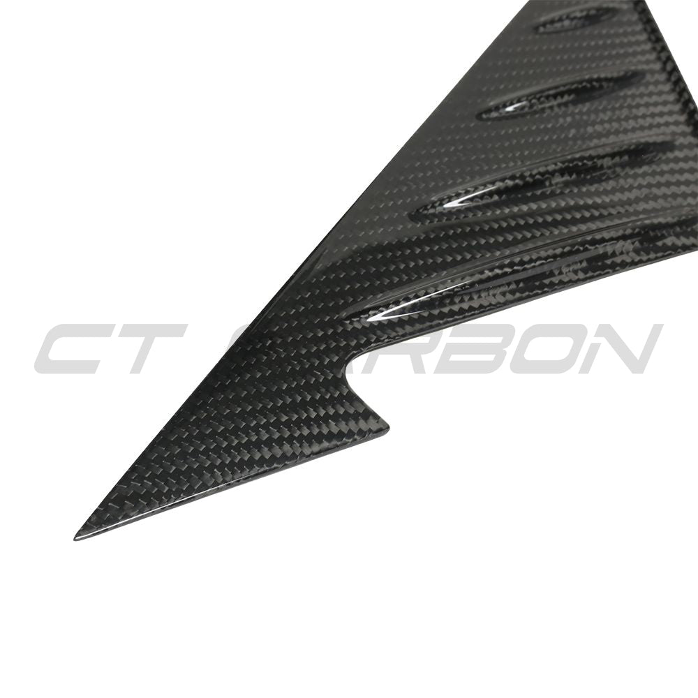 BMW G22/G23/G26 4 Series 2021+ dry carbon fiber mirror pillar trim by CT Carbon, close-up view showing textured finish.