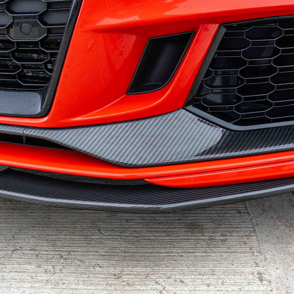 Audi RS3 8V facelift carbon fiber bumper trim accessory by CT Carbon, close-up view of lightweight, textured carbon fiber material.