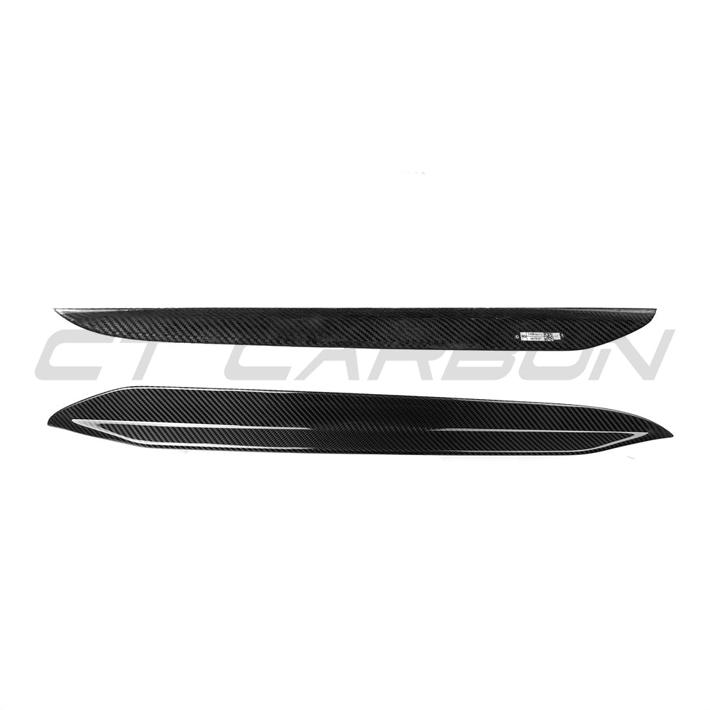 BMW X6 G06 Carbon Fibre Rear Window Trims by CT Carbon installed on the vehicle, showcasing sleek, glossy black accents.