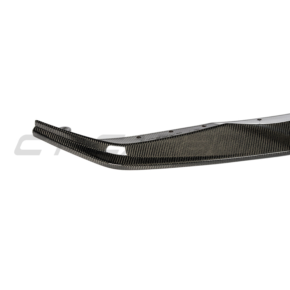 BMW G83 M4 full carbon fiber kit by CT Carbon, showing detailed carbon fiber components on the car's exterior.