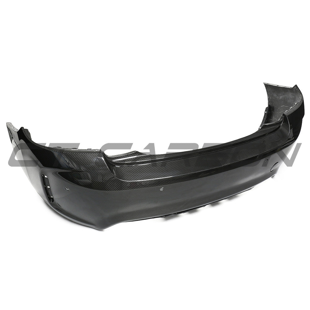 BMW F87 M2/M2C carbon pre-preg fibre rear bumper by CT Carbon showing sleek black carbon finish and aerodynamic design.