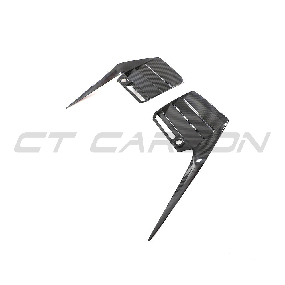 BMW G87 M2 2023 carbon fibre rear bumper trim by CT Carbon, showcasing sleek, lightweight accessory detail on the vehicle.