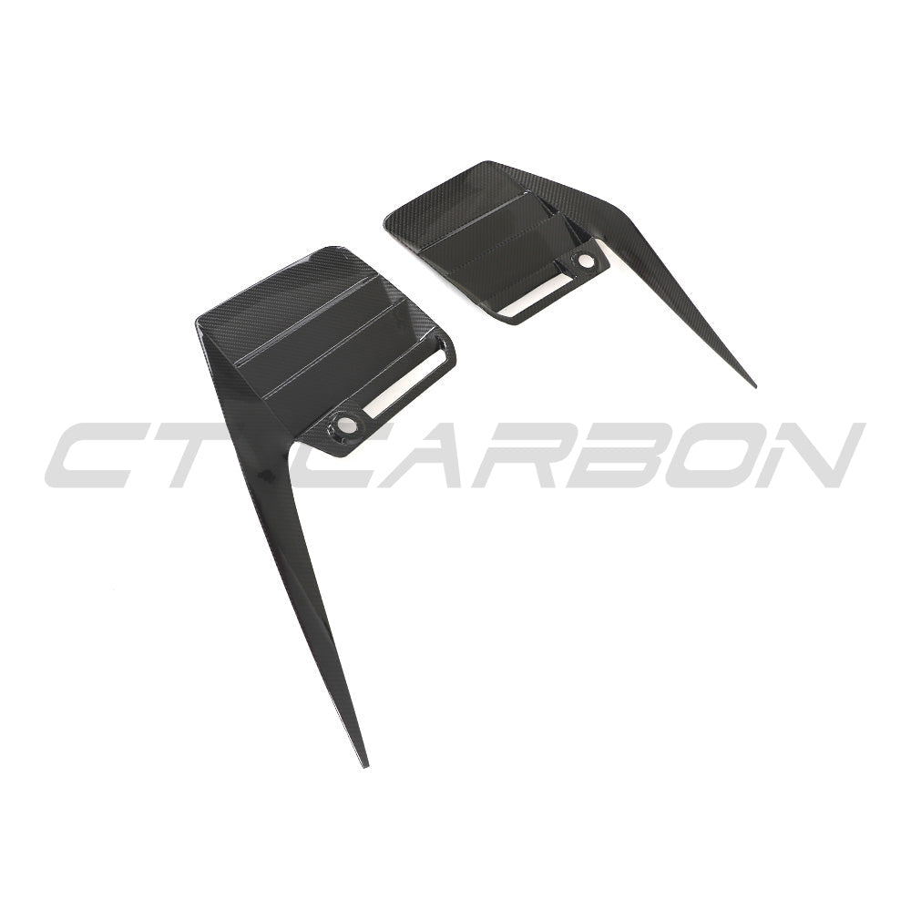 BMW G87 M2 2023 carbon fibre rear bumper trim accessory by CT Carbon, showcasing sleek, lightweight carbon fibre design.