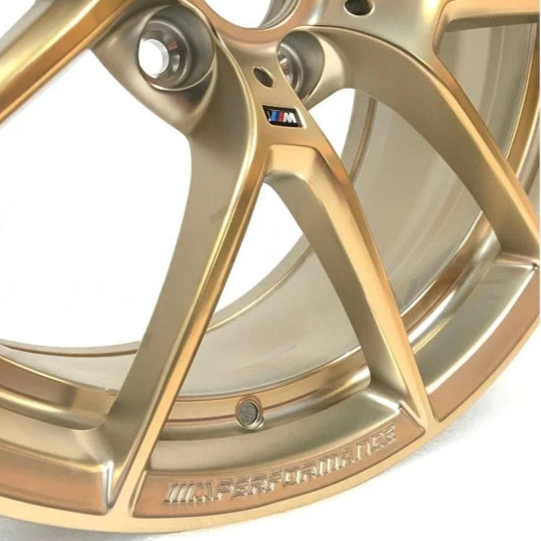 Genuine BMW F87 M2 763M Frozen Gold Wheel Set featuring 19-inch alloy wheels with a sleek, sporty design.
