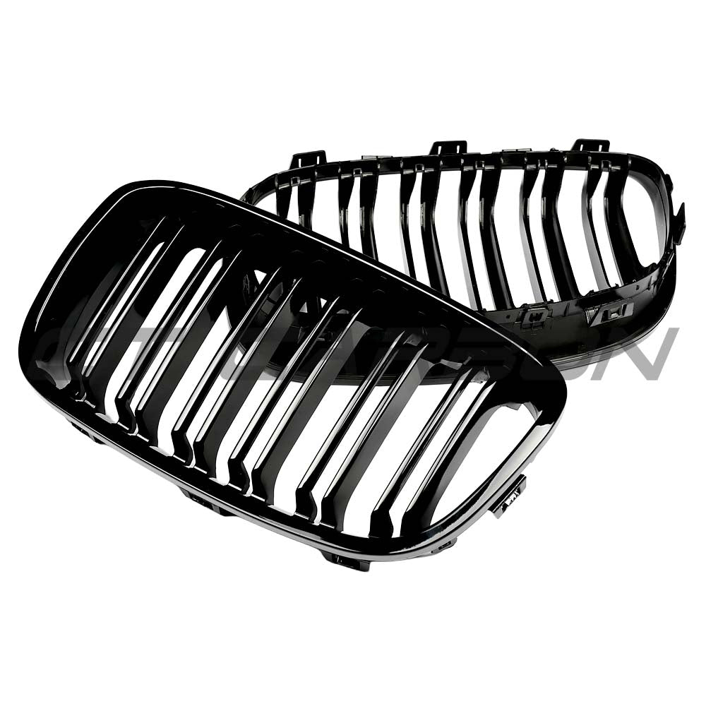 BMW F20 1 Series 2011-2019 gloss black grille with dual slats from CT Carbon, showcasing a sleek, aftermarket car accessory.