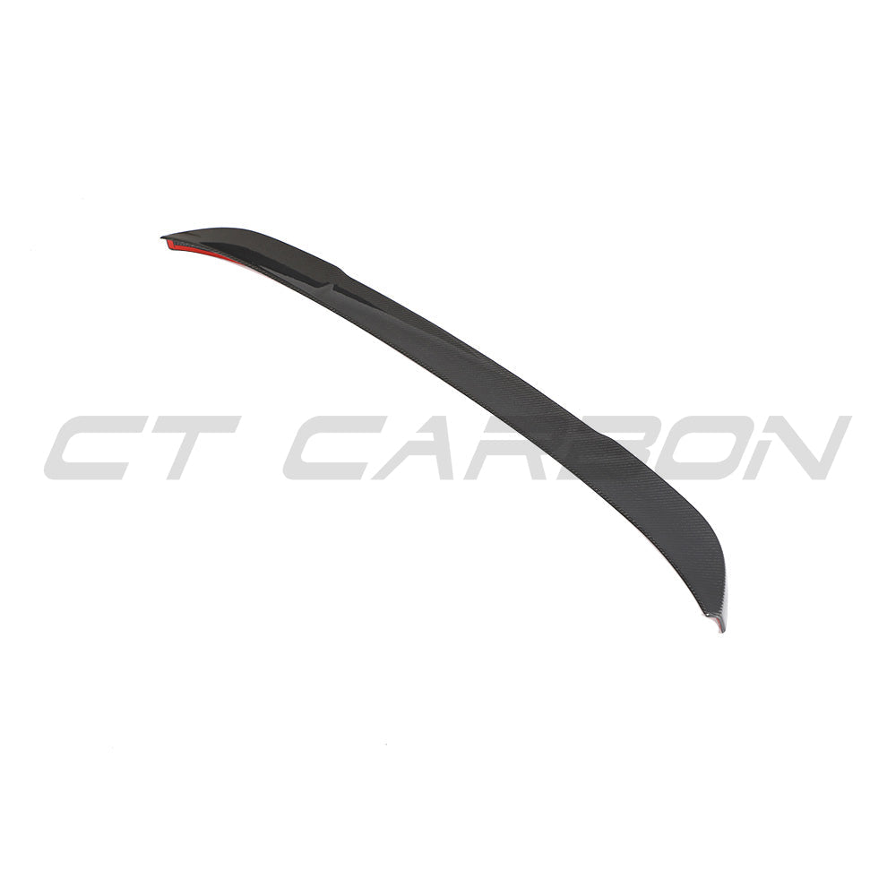 BMW G02 X4 and F98 X4M carbon fibre spoiler by CT Carbon, showcasing the sleek, aerodynamic design on a dark sports car.