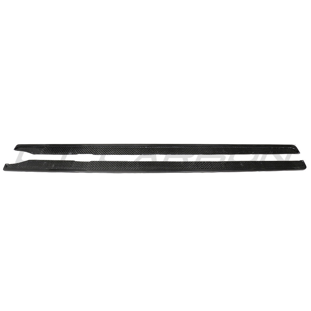 BMW G87 M2 carbon fibre side skirts by CT Carbon mounted on the vehicle, showcasing sleek, lightweight aerodynamic design.