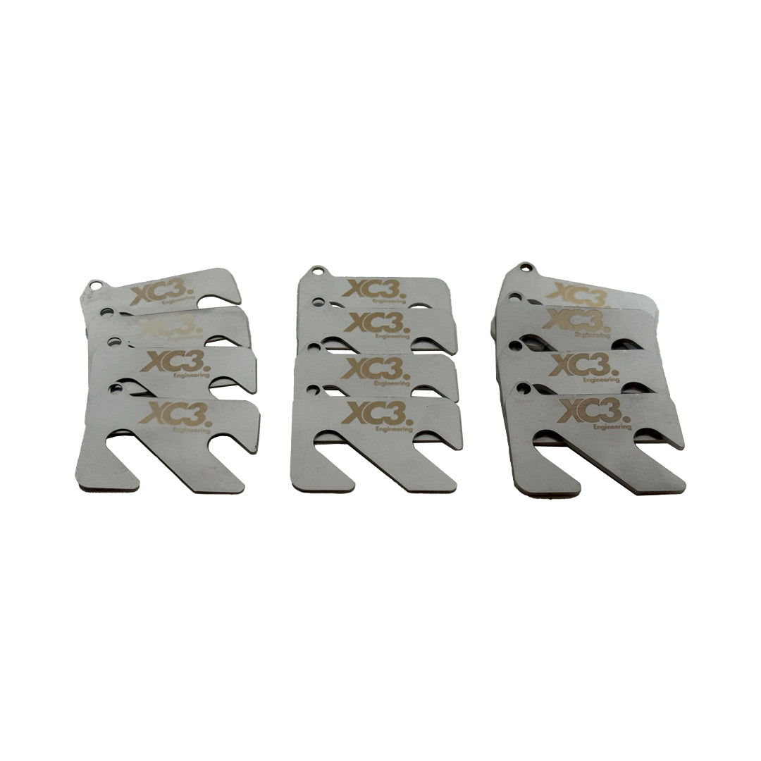 Porsche 911 991 GT3 RS front camber shim kit by XC3 Engineering, suspension and alignment components, close-up of shims.