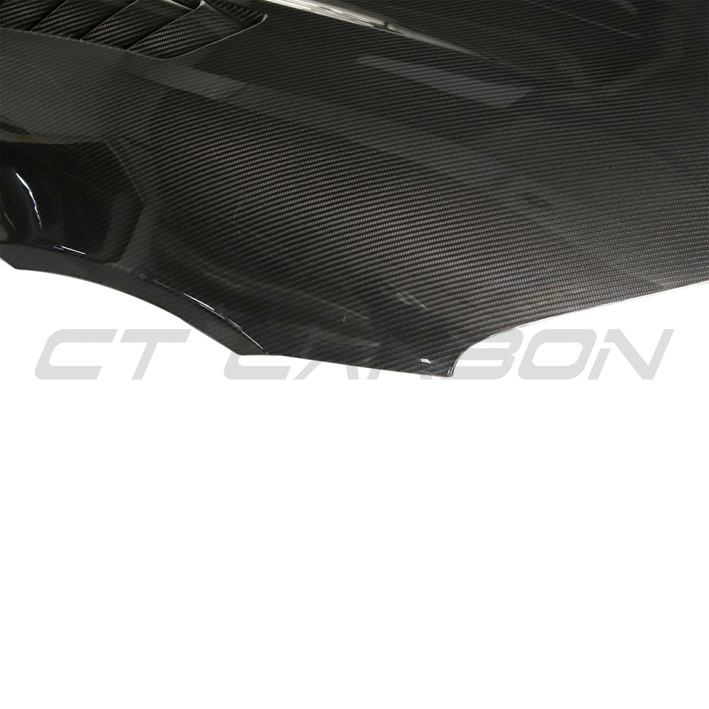 Toyota Supra 2019+ A90 CT Carbon carbon fiber front hood/bonnet with a sleek, aerodynamic design and detailed carbon fiber weave.