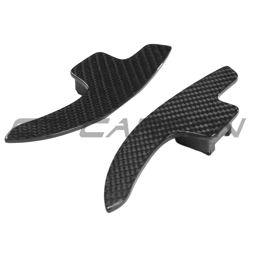Carbon fiber shifter paddles for Audi A3, S3, RS3 8V models by CT Carbon, shown on the steering wheel.