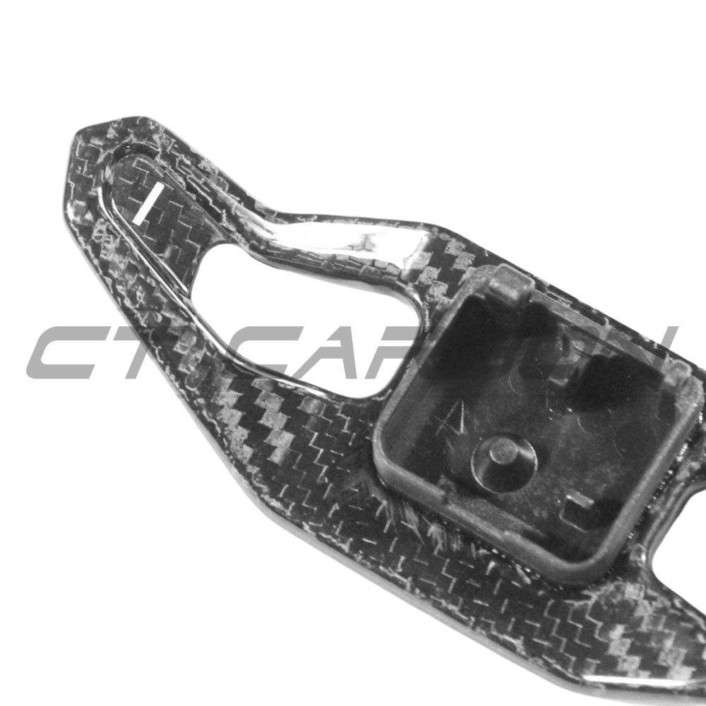 Carbon fiber shifter paddles for Audi A3, S3, RS3 8V by CT Carbon, featuring a sleek V2 design for sporty interior upgrade.