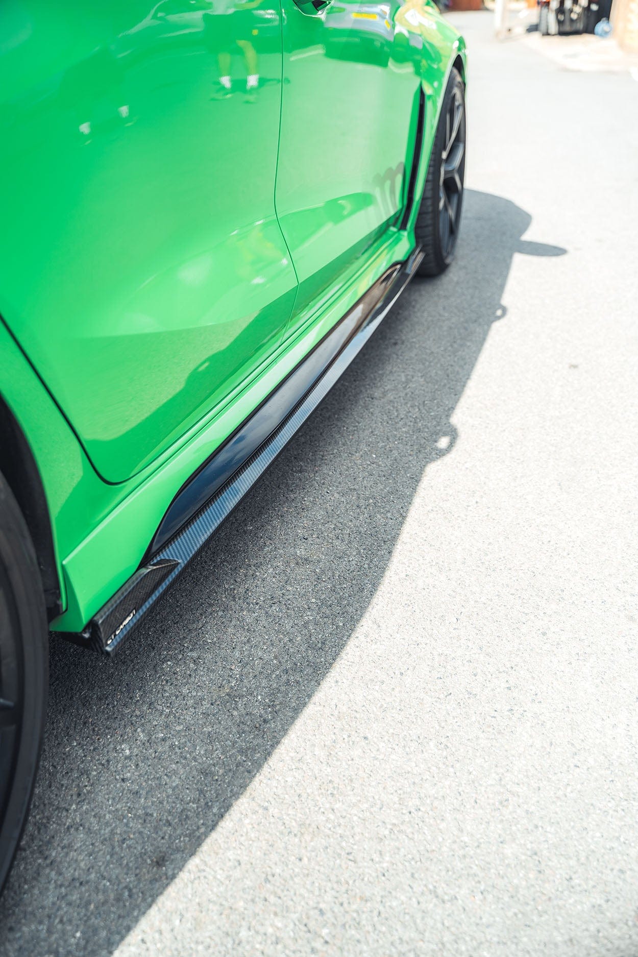 Audi RS3 8Y 2022+ carbon fibre side skirts by CT Carbon, showing sleek, lightweight exterior enhancement for sporty look.