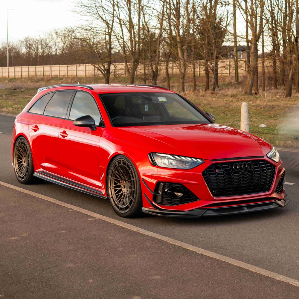 Audi RS4 B9.5 carbon fiber front canards by CT Design, lightweight automotive accessories, featuring sleek black carbon fiber finish.