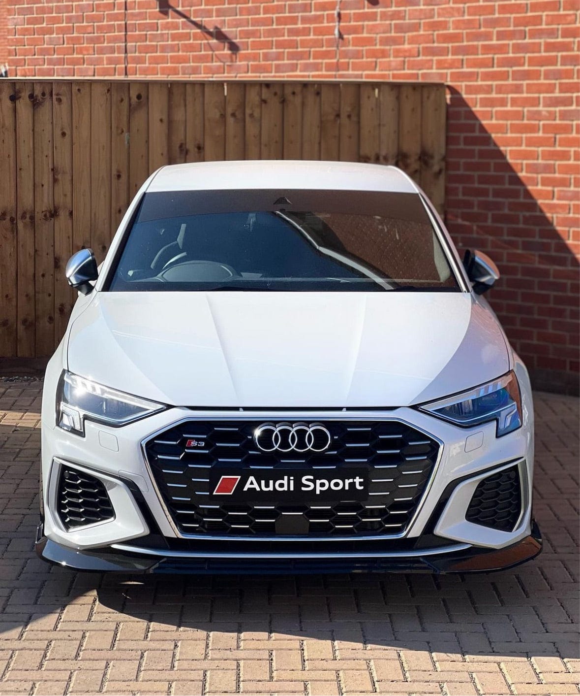 Gloss black splitter for Audi S3/A3 8Y S-Line 2020-2025 by CT Carbon, showcasing the sleek aerodynamic design.