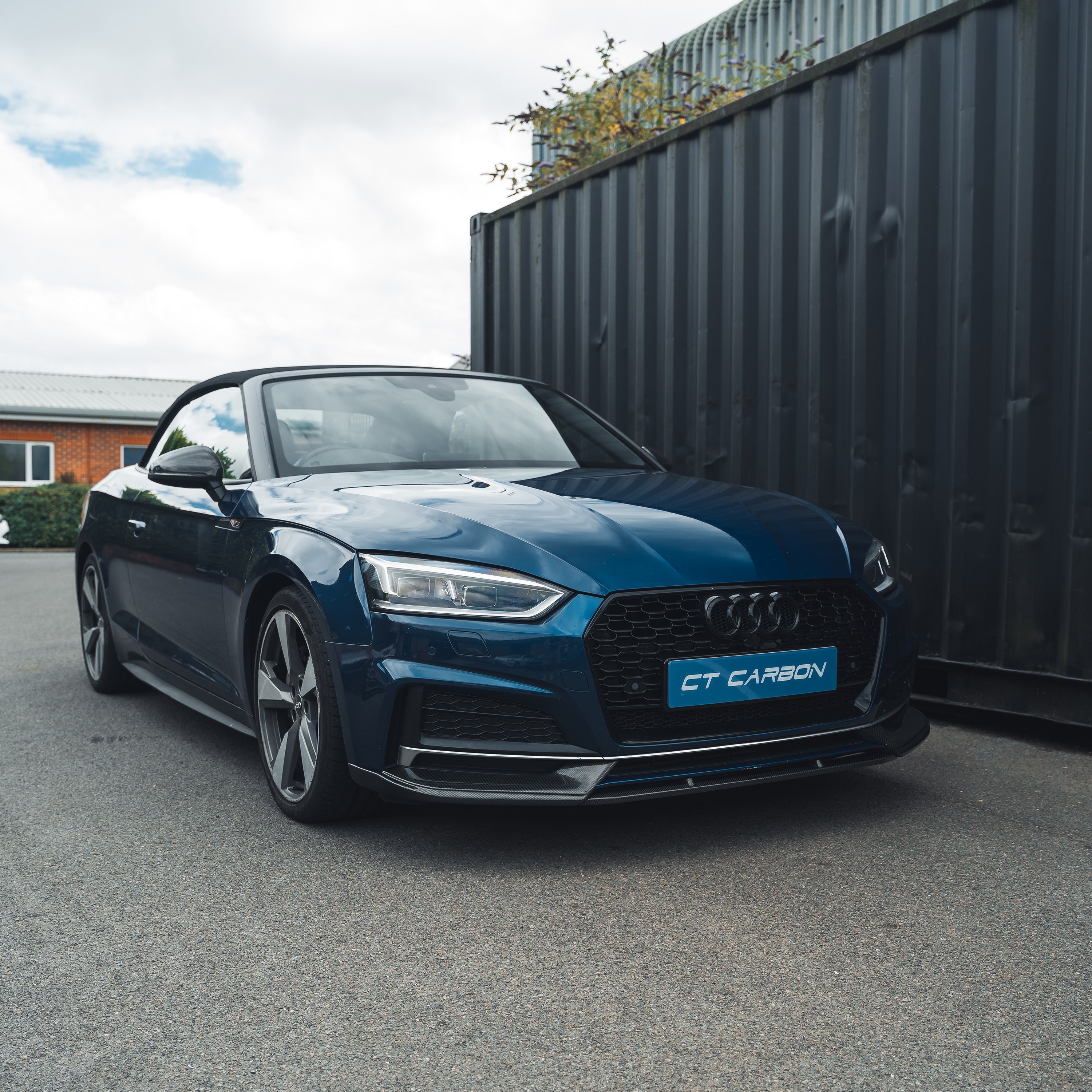 Carbon fiber splitter for Audi A5 S5 B9 (2017-2021) by CT Carbon, shown installed on the front bumper.