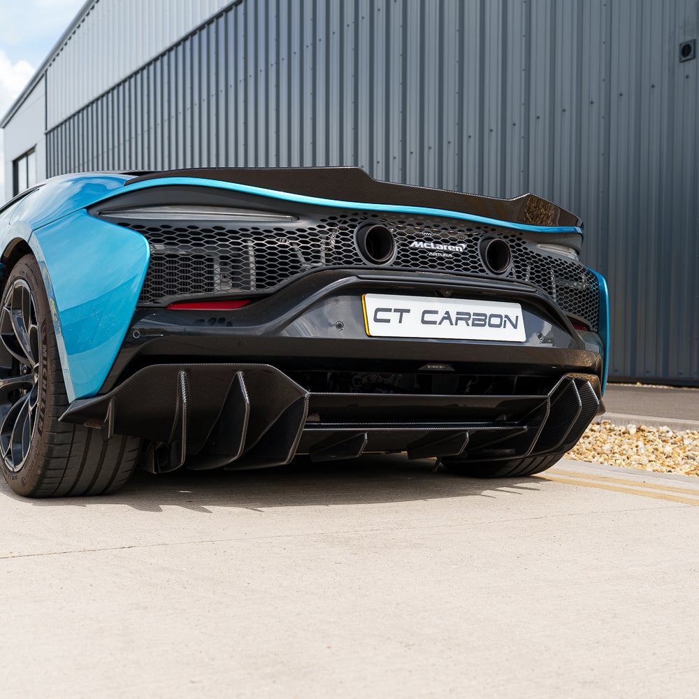 Carbon fiber diffuser for McLaren Artura 2023 by CT Carbon, showcasing sleek, aerodynamic design on a high-performance car.