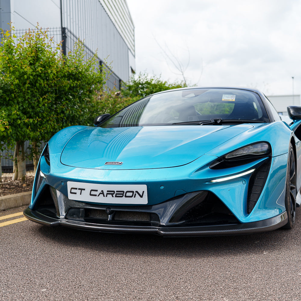 Full view of the CT Carbon McLaren Artura full carbon fiber kit installed on the car, showcasing sleek, lightweight carbon fiber detailing.