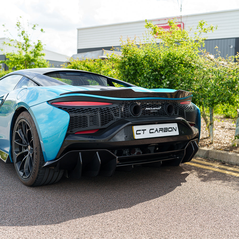 Full view of the CT Carbon McLaren Artura full carbon fibre kit on a car, showcasing sleek black carbon fibre details.