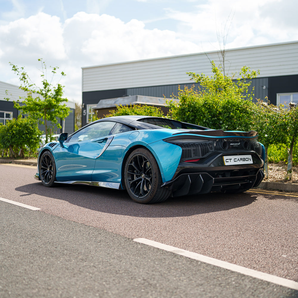 CT Carbon McLaren Artura 2023 carbon fibre diffuser showing sleek design and aerodynamic details on a sports car.