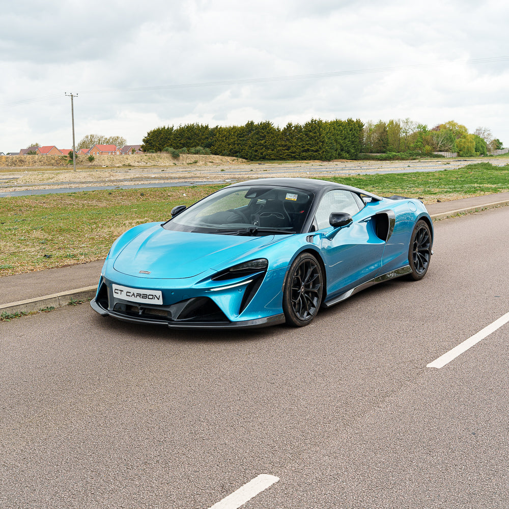 Full car image of the CT Carbon McLaren Artura full carbon fibre kit V1 showing detailed carbon fiber exterior on a sleek sports car.