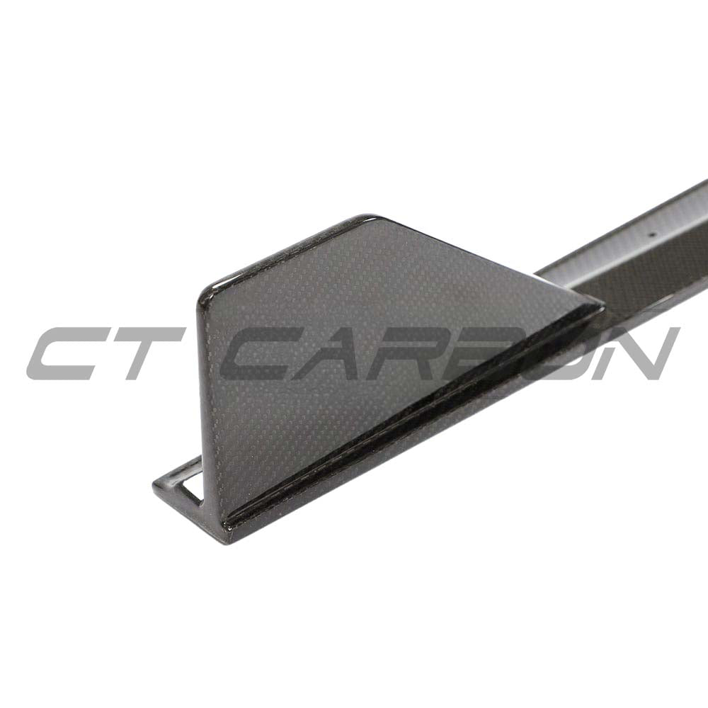 BMW 1 Series F40 carbon fibre side skirts by CT Design, showcasing sleek, aerodynamic car body enhancements with a carbon finish.