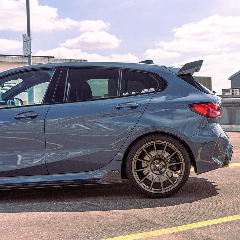 BMW 1 Series F40 and F70 carbon fibre wing spoiler by CT Design, featuring a sleek, aerodynamic design for enhanced performance.
