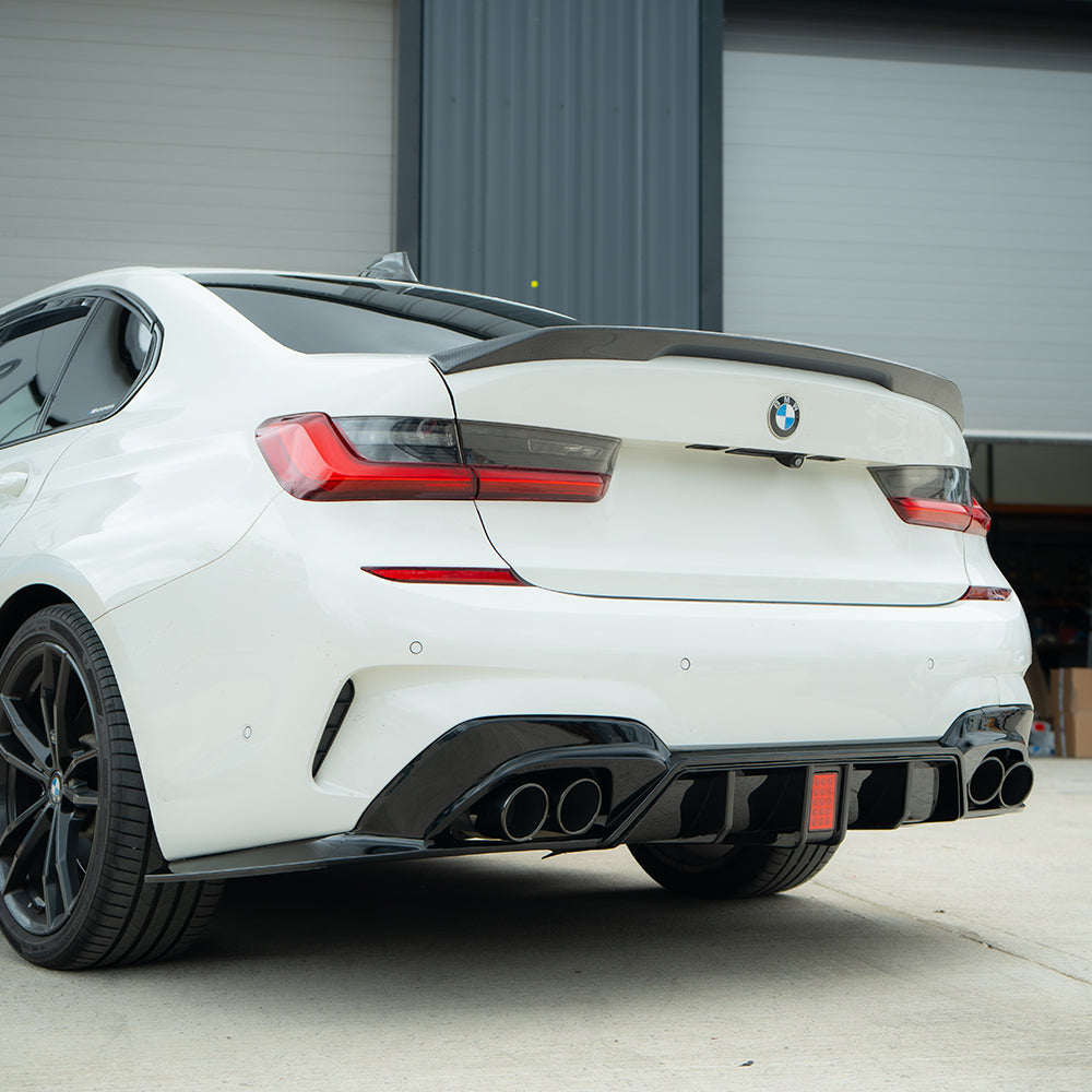 BMW G20 G21 3 Series 2019-2022 CT Carbon gloss black diffuser with LED accents and exhaust tips, shown on the rear of the vehicle.