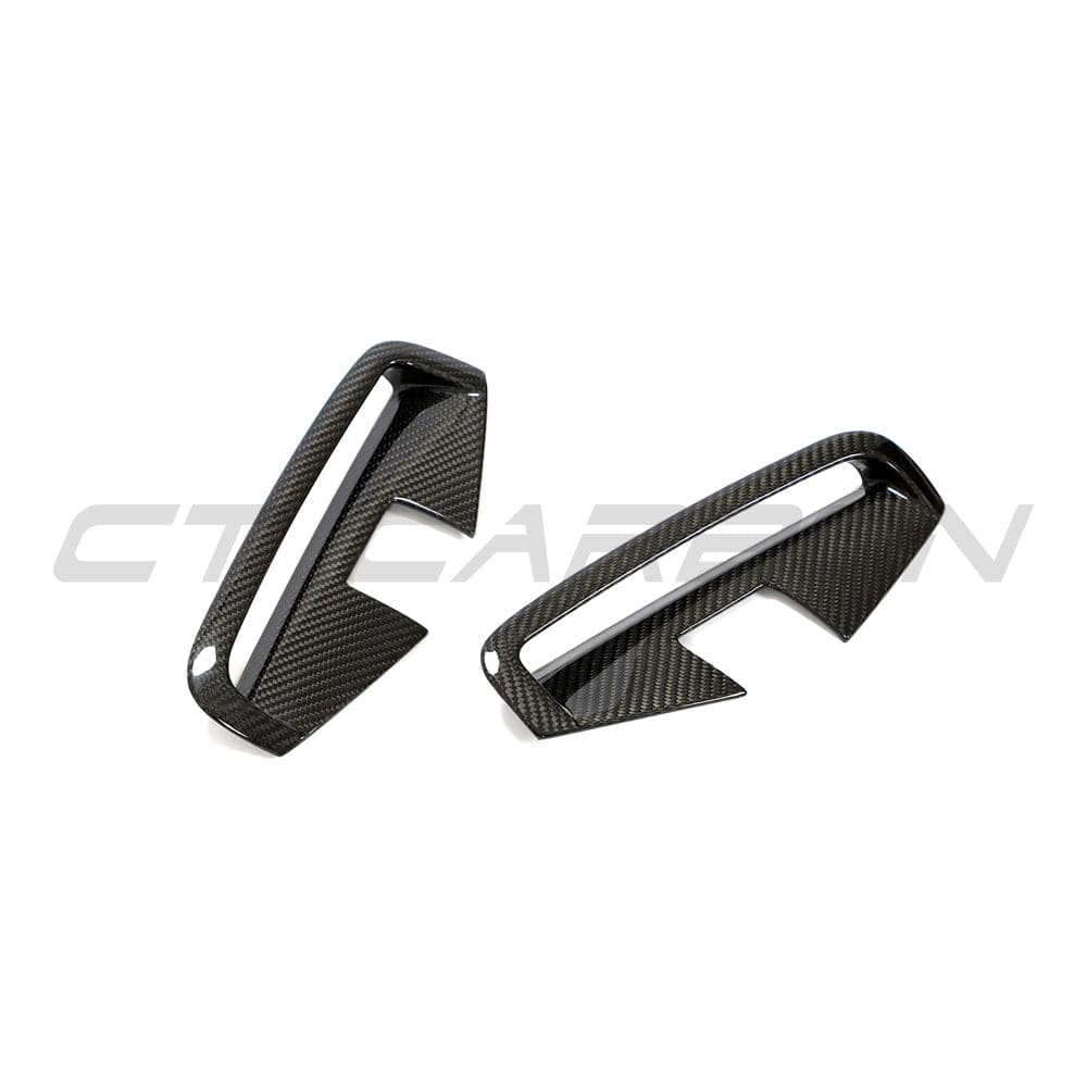 Set of four carbon fiber vent accessories for BMW 4 Series G22/G23 2020+, featuring sleek black finish and detailed design.