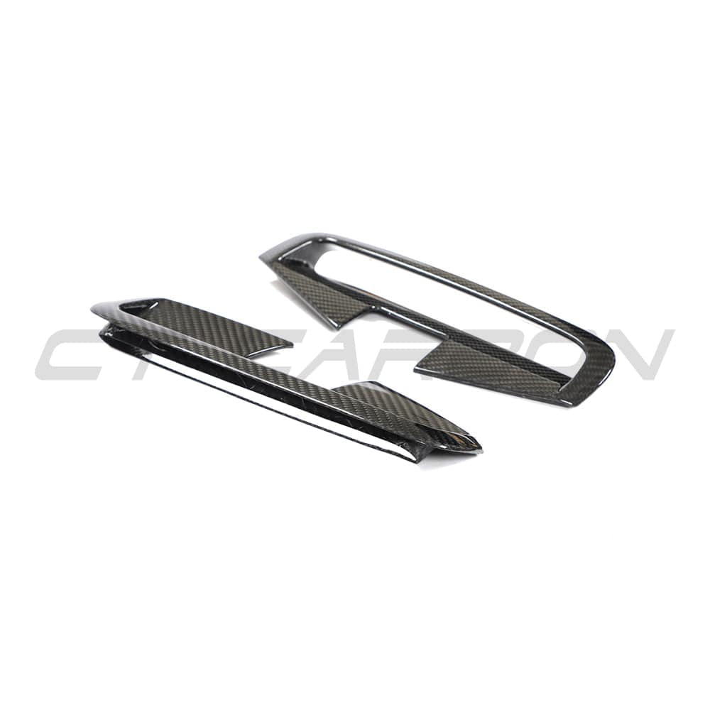 Set of four carbon fibre vents for BMW 4 Series G22 G23 2020+ by CT Carbon, showcasing sleek, textured carbon fiber design.