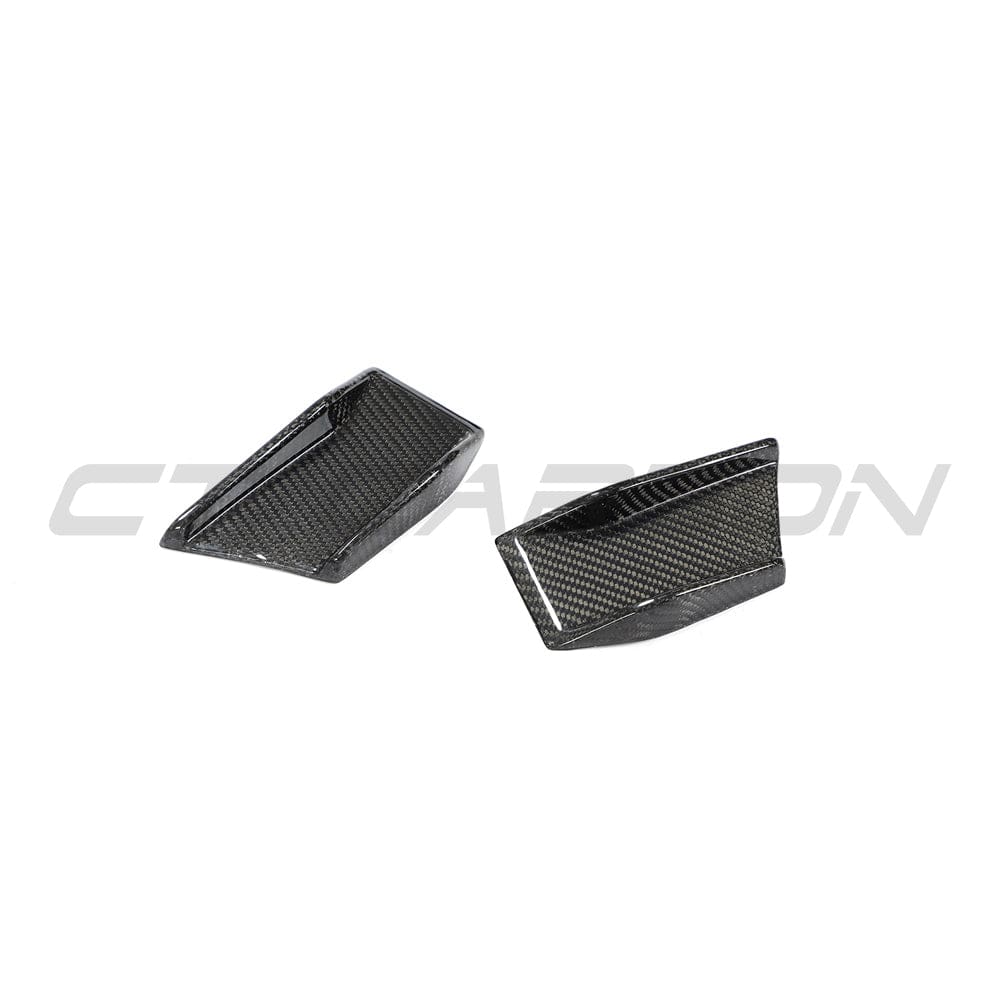BMW 4 Series G22 G23 carbon fibre canards, automotive accessories by CT Carbon, shown on the front of the vehicle.